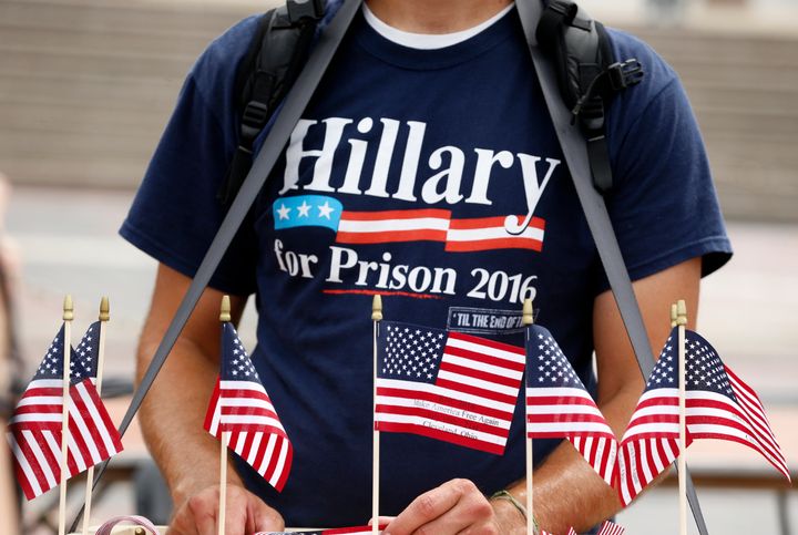 A Trump supporter sells flags while wearing a "Hillary For Prison 2016" shirt near the Republican National Convention in Cleveland on July 18, 2016.