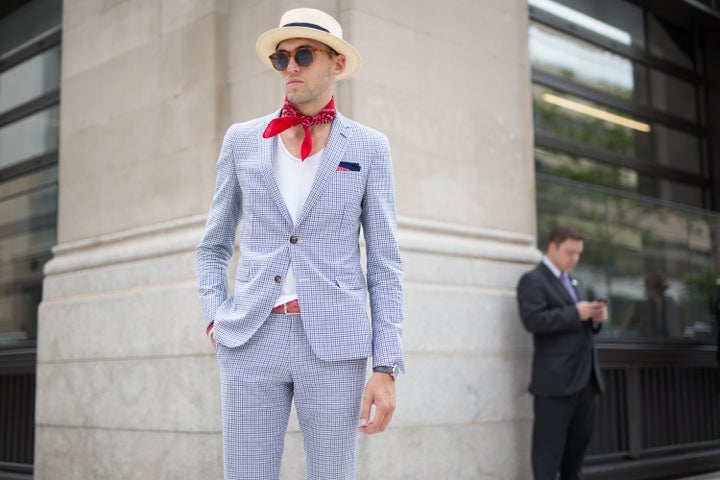 A man attends a presentation during New York Fashion Week: Men's wearing -- you guessed it! -- a neck scarf.