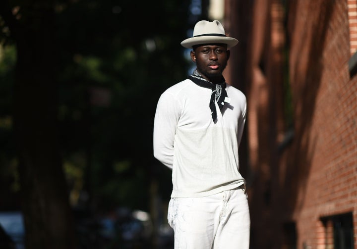 Blogger Steven Onoja wears a neckerchief outside the Uri Minkoff fashion show