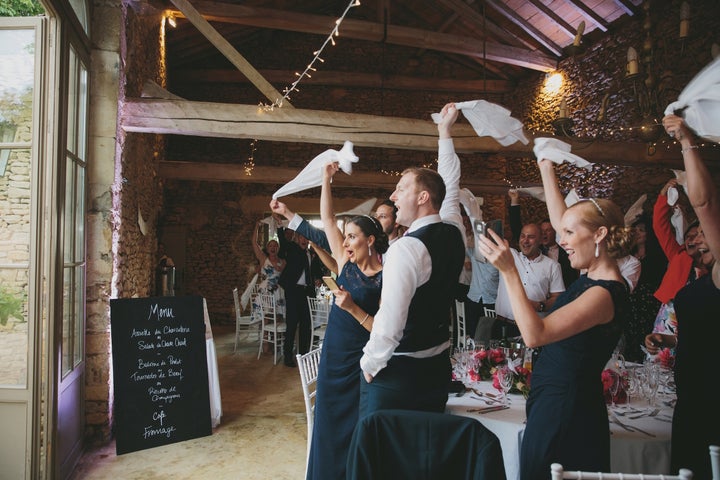 Welcoming the new Mr and Mrs with handkerchiefs- a french tradition. 