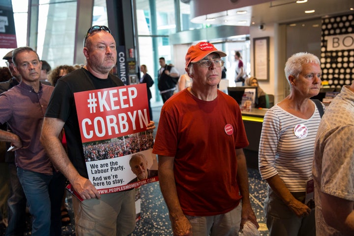 Supporters wait to enter the rally