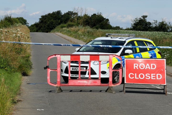 Police close a road after the incident