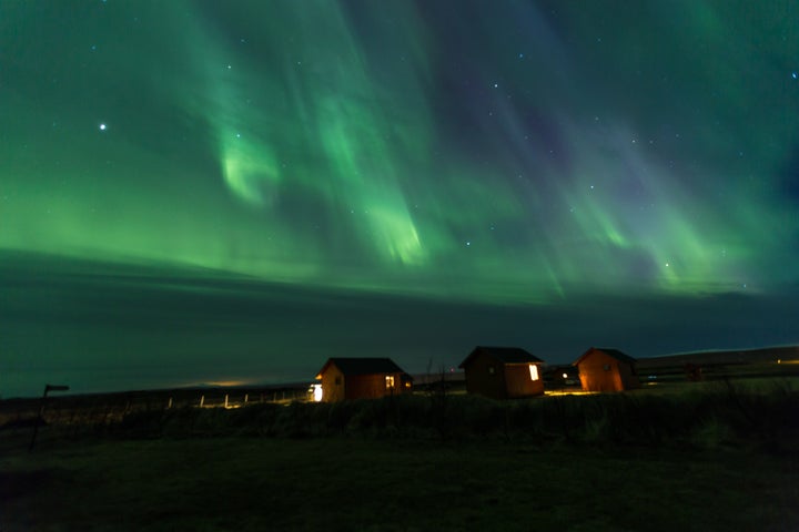 NORTHERN LIGHTS OVER THE HVAMMSTANGI COTTAGES