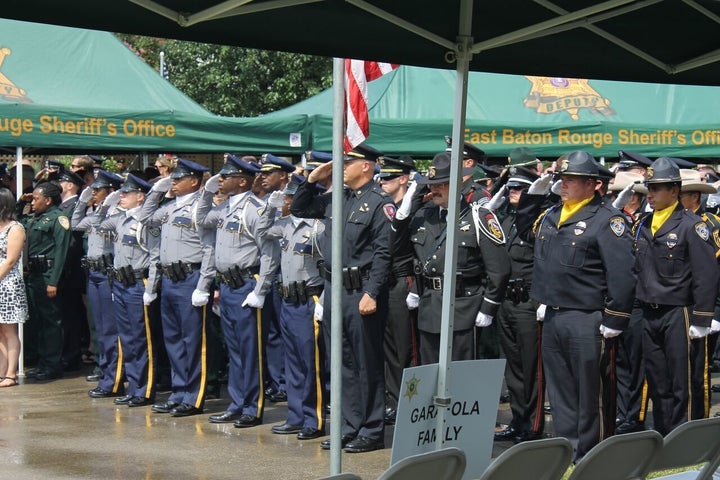 Officers pay their respects at the funeral for Deputy Brad Garafola.