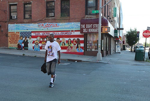 <i>Photo by Nancy A. Ruhling</i><br><strong>Ron's <i>We Are All Family</i> mural on 8th Street at Astoria Boulevard.</strong>