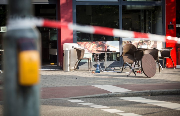 A police line is seen near the site where a Syrian asylum-seeker killed a woman and injured two people with a machete in Reutlingen, southern Germany