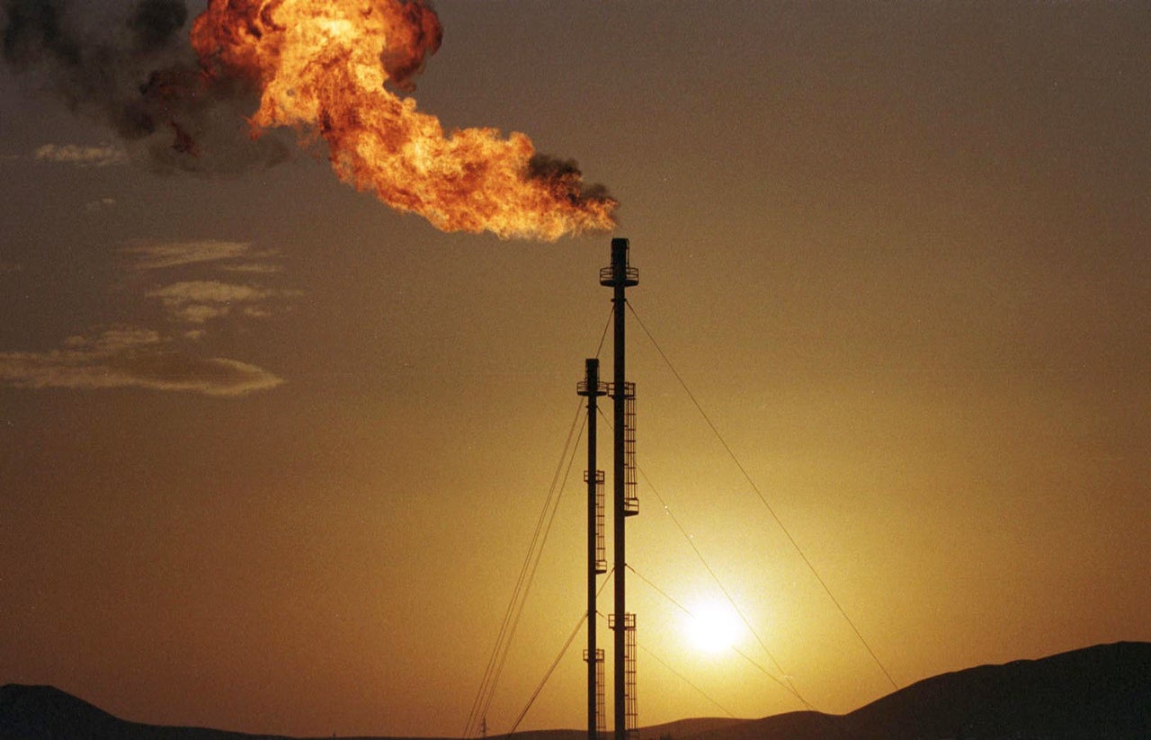 The sun sets behind the stacks at the gas plant at the state-run Sonatrach gasfileds many miles south-east of Algiers. The company is embroiled in a bribery scandal involving an Italian energy company orchestrated by Bedjaoui.