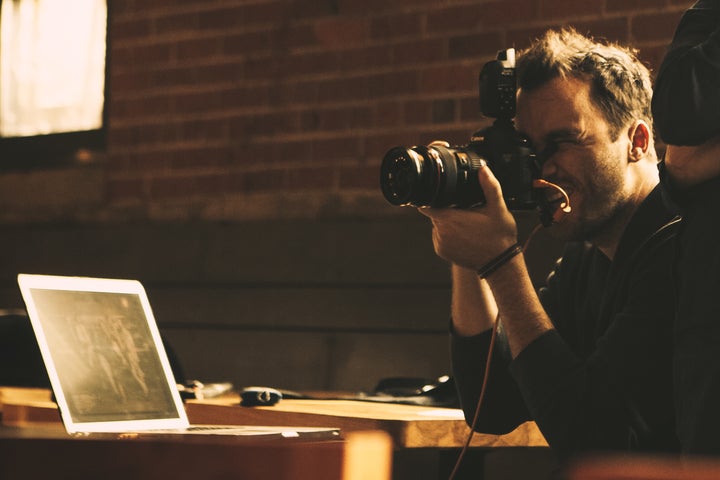 Celebrity photographer Jeremy Cowart working on a photo project