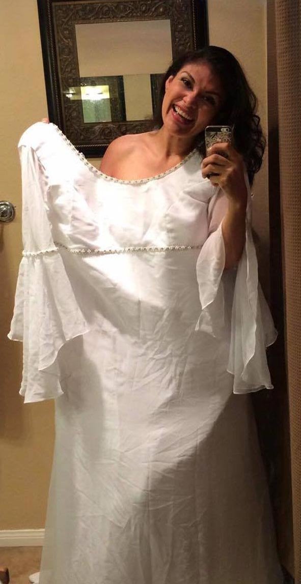 Monica Perez in her wedding dress, which is now twice her size. 