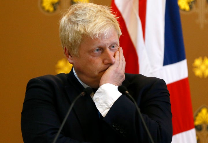 Foreign Secretary Boris Johnson listens during a press conference with US secretary of state John Kerry (unseen) at the Foreign Office in London.