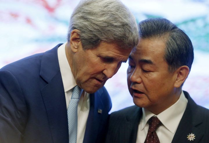 U.S. Secretary of State John Kerry and China's Foreign Minister Wang Yi talk at the 5th East Asia Summmit at the 48th Association of Southeast Asian Nations (ASEAN).