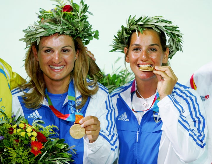 Sofia Bekatorou, right, celebrates with teammate Aimilia Tsoulfa after earning gold medals in the regatta at the 2004 Olympic Games in Athens on August 21, 2004.