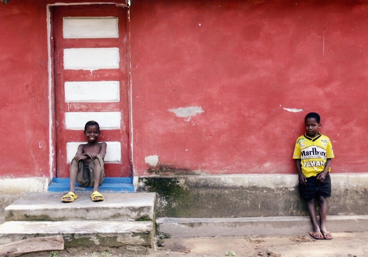 MOZAMBIQUE- JULY 2 : Two young boys stand outside their family home in a small village outside Quelimane, on July 2, 2005 in, Mozambique. Since Mozambique's 15-year civil war ended in 1992, the country has made a strong recovery. However, it suffered setbacks with severe floods in 2000 and 2001, followed by two years of drought in 2002 and 2003. These emergencies had a huge impact and led to widespread food shortages, an increase in outbreaks of infectious diseases, including cholera, measles and meningitis. Families in rural areas in particular suffer from poverty and a lack of basic services. About 13 per cent of babies die before their first birthday, 20 per cent of children die before the age of five, and 48 per cent of the country's children are chronically malnourished. The HIV/AIDS pandemic is having a devastating effect on families, with tens of thousands of children orphaned, many of them also HIV-positive or already ill with AIDS. (Photo by Graeme Robertson/Getty Images)