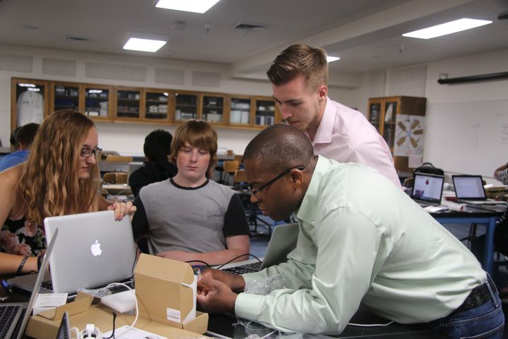 Left to right: Coding camp students Kara Kennedy and Christian McCarty; Instructors Colin Axner and Steve Callahan.
