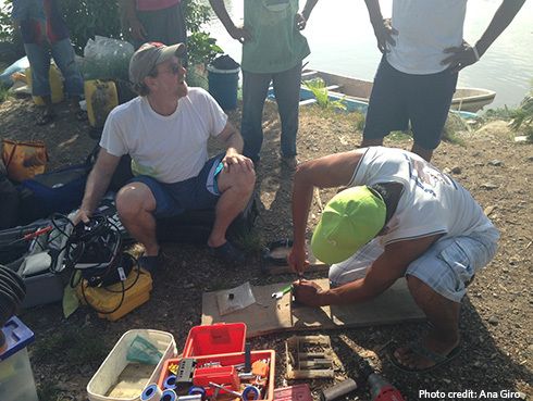 Will Heyman prepares equipment to map the seafloor at a possible fish spawning site off the coast of Guatemala in 2015.
