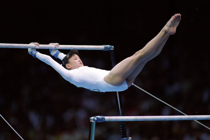 Amy Chow on the uneven bars during her routine at the Georgia Dome in the 1996 Olympic Games.