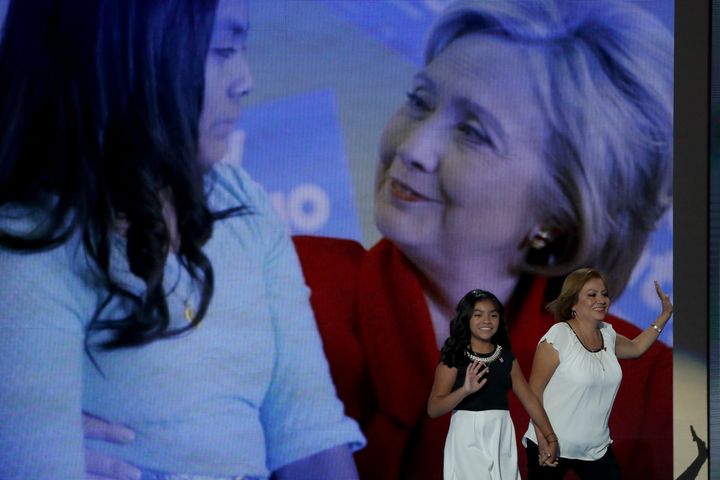 Karla Ortiz, 11, and her mother, Francisca Ortiz, stood in front of a large image of Karla with presumptive Democratic presidential nominee Hillary Clinton.