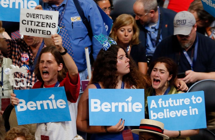 Supporters of Sen. Bernie Sanders (I-Vt.) listen to him speak during the Democratic National Convention in Philadelphia on Mo
