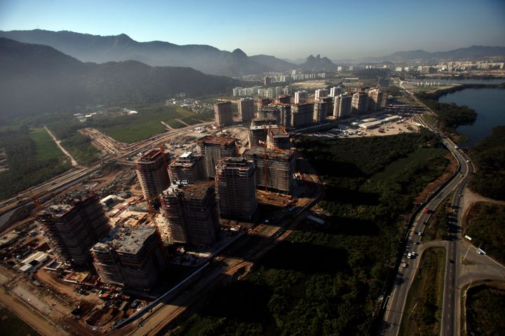 Buildings stand under construction in the athlete's village and park for the 2016 Summer Olympics in this aerial photo taken over the Barra da Tijuca neighborhood of Rio de Janeiro, Brazil, on Friday, Aug. 22, 2014.