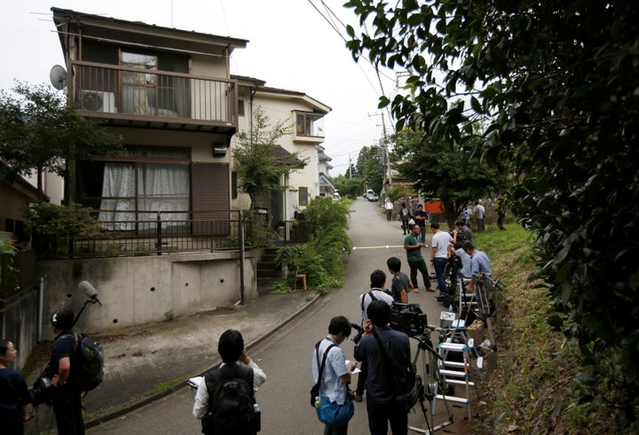 Media members gather in front of the home of a man who went on a deadly attack at a facility for the disabled, near the facility in Sagamihara, Kanagawa prefecture, Japan.