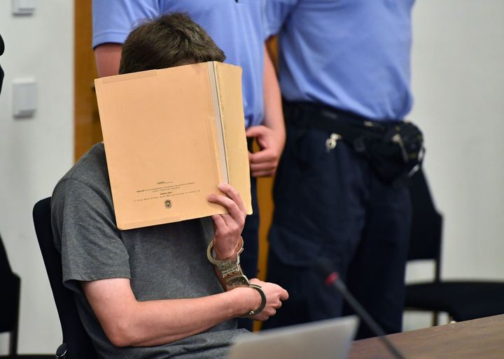 Now-convicted killer Silvio S. hides his face as he arrives for another session of his trial on July 12, 2016 at the district court of Potsdam, eastern Germany.