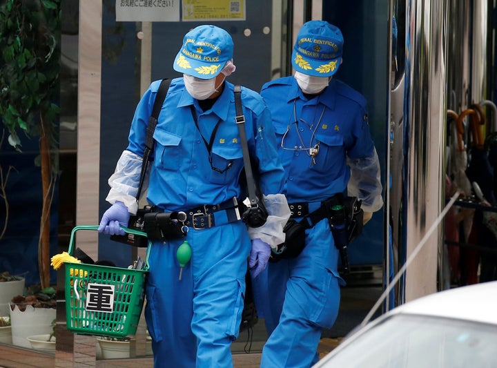 Police officers investigate at a facility for the disabled, where a deadly attack by a knife-wielding man took place, in Sagamihara, Kanagawa prefecture.