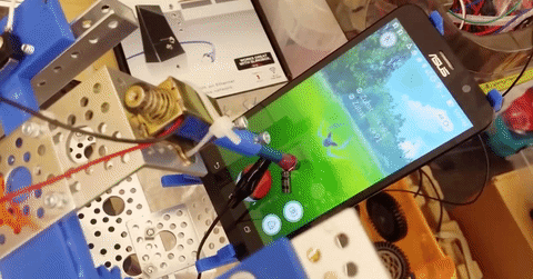 A very basic version of the "Pokemon Go" robot grabs a pokeball.