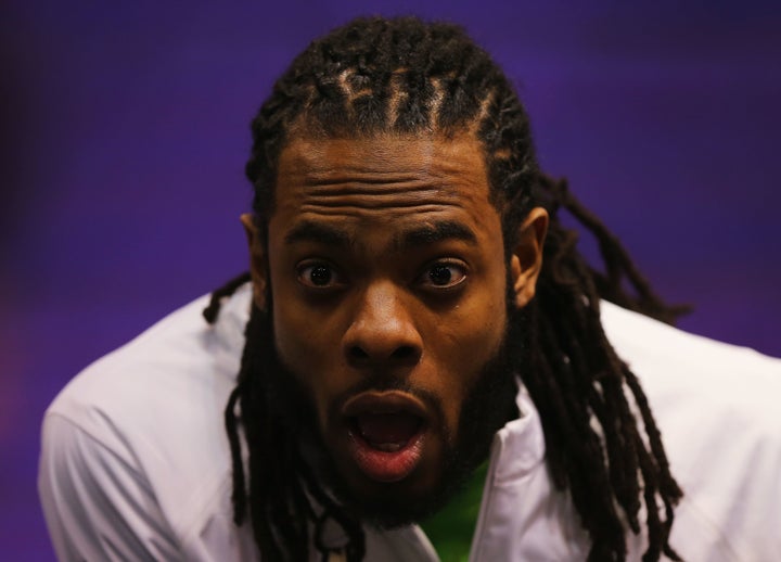 Richard Sherman of the Seattle Seahawks addresses the media at Super Bowl XLIX Media Day on January 27, 2015.