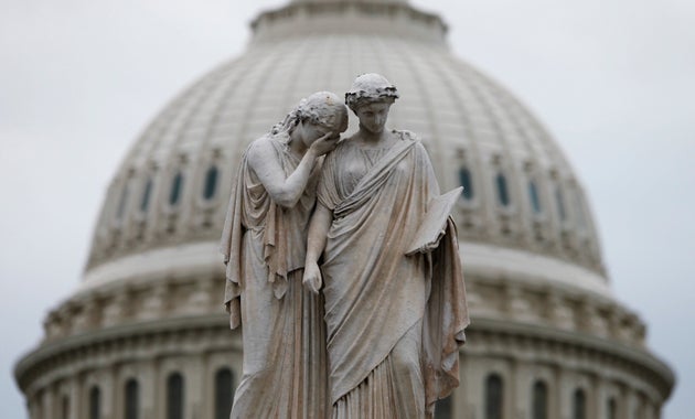 The statue of Grief and History in front of the&nbsp;U.S. Capitol Dome in