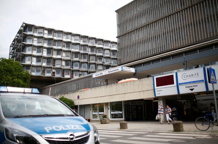 A police car is parked in front of the university clinic in Steglitz, a southwestern district of Berlin.