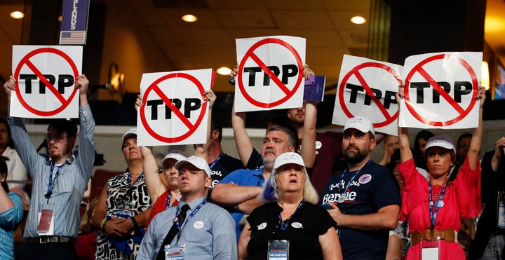 Delegates protest the controversial trade deal during the Democratic convention in Philadelphia.