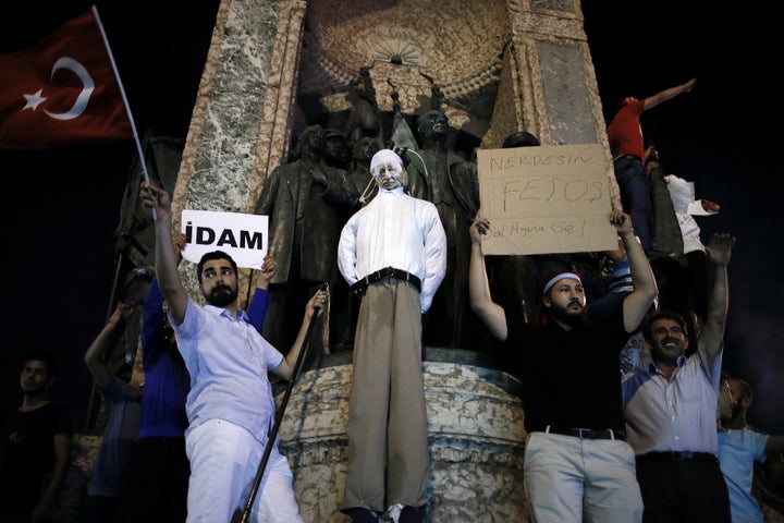 Supporters of the Turkish president hold an effigy of Gulen handing by a noose in Istanbul last week, but author Joshua