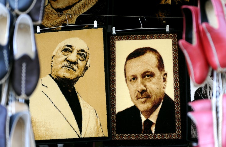 Gulen and Erdogan, pictured above in embroidered images in a Turkish market, were once allies, but are now bitter rivals.