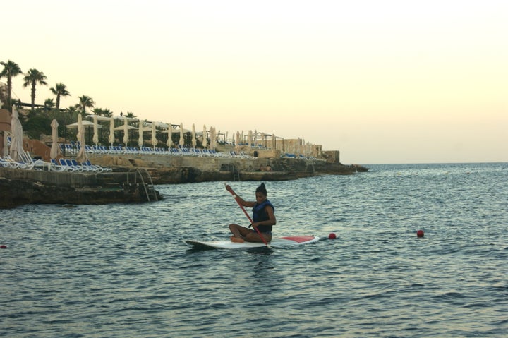 Trying my hand at paddle boarding.