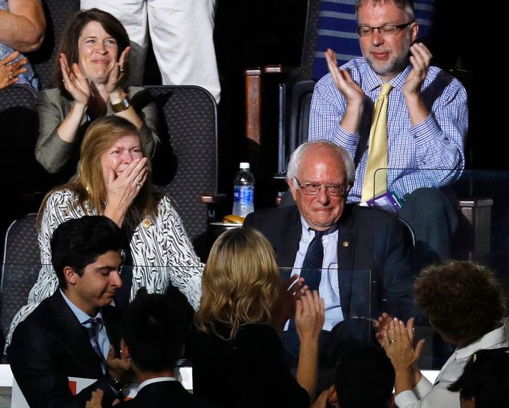 Bernie Sanders and his wife Jane react to his brother Larry making the presidential nomination roll call for Democrats Abroad at the Democratic National Convention in Philadelphia