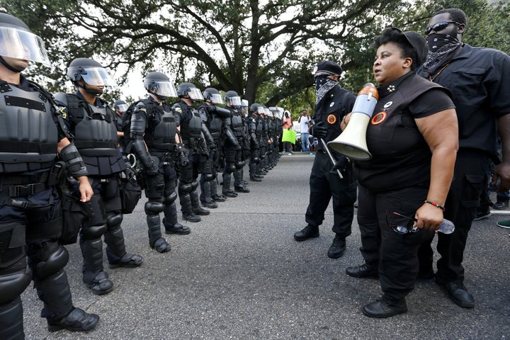 Demonstrators protest the shooting death of Alton Sterling near the headquarters of the Baton Rouge Police Department in Baton Rouge, Louisiana, on July 9.