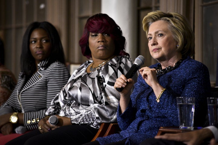 Democratic U.S. presidential candidate Hillary Clinton (R) speaks during an event with former Attorney General Eric Holder and the anti-gun violence group Mothers of the Movement at St. Paul's Baptist Church in Philadelphia in April.