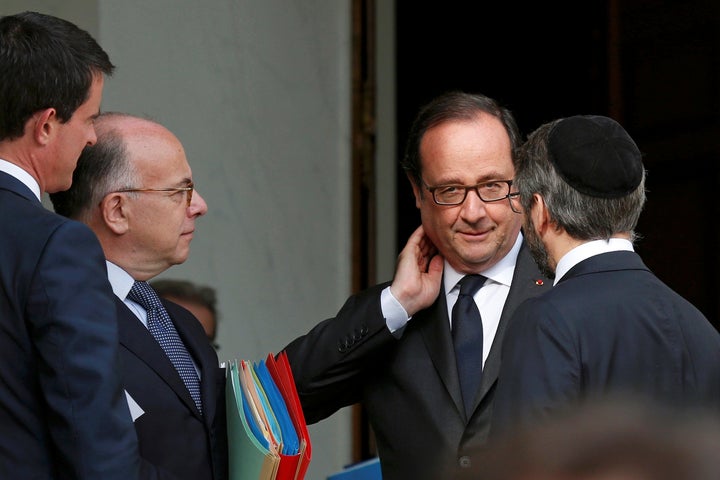 French President Francois Hollande met with France’s religious leaders on Wednesday after two Islamist militants killed a Roman Catholic priest in a church.