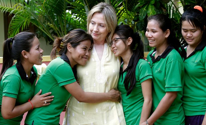 U.S. Secretary of State Hillary Clinton is greeted by human trafficking victims Van Sina (2nd L) and Somana (3rd R) at the Siem Reap AFESIP rehabilitation and vocational training center October 31, 2010. Clinton's visit to Cambodia is the first by a U.S. Secretary of State since 2003. REUTERS/Chor Sokunthea