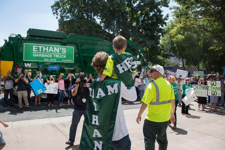 Ethan sees his garbage truck. 