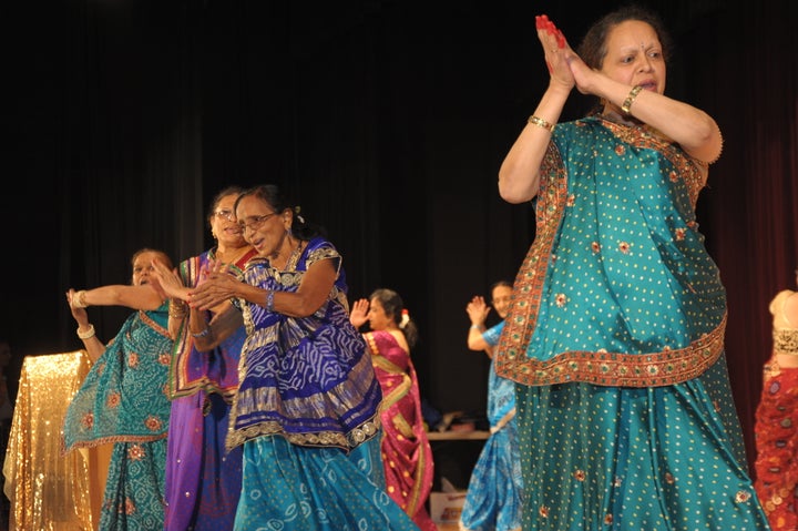 Seniors from India Home dance the garba, a vigorous folk dance from the state of Gujarat in western India.