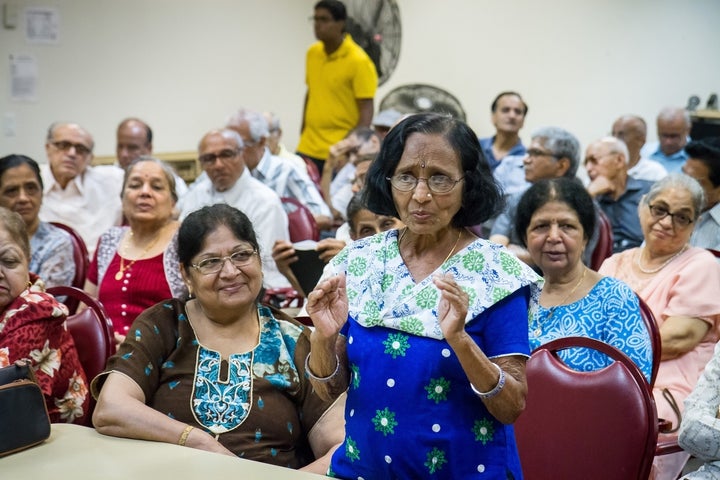 Seniors at India Home's satellite center at Sunnyside Community Services in Queens, New York, look on as Kamuben Chavda speaks on Father’s Day. They are part of the first generation of South Asians of South Asians aging in America.