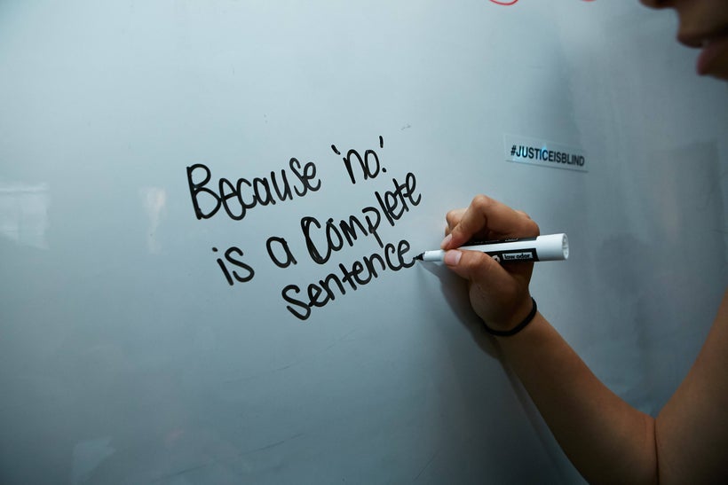 Someone articulating their stance on rape at an event.