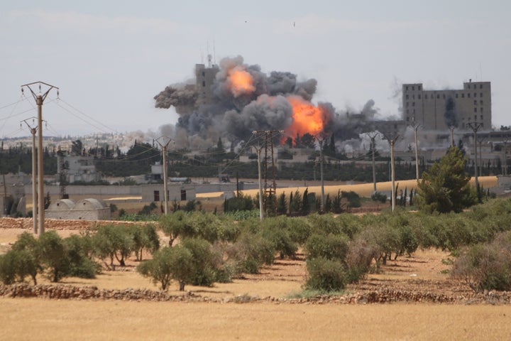 Smoke and flame rise after what fighters of the Syria Democratic Forces (SDF) said were U.S.-led air strikes on the mills of