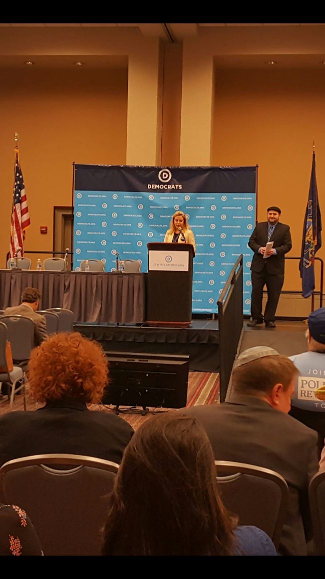 Sarah Bard addresses the Jewish Roundtable (DNC Director of Jewish Engagement Aaron Weinberg looks on)