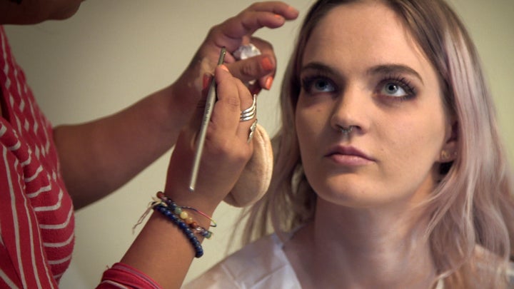 Jade having her makeup done professionally for a shoot.