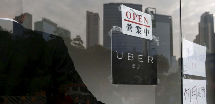 An open sign is seen at the office of Uber Inc during a driver recruitment event in Hong Kong, China December 29, 2015.