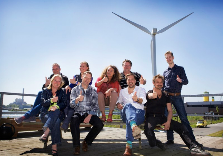 NDSM Energy cofounders at NDSM Wharf in 2013. NDSM Energy aims to provide the NDSM Shipyard with sustainable and environmentally friendly energy by cooperatively developing renewable energy projects. Engineer Martijn Pater, NDSM Energy Executive Director is third from right. Eva de Klerk, prime mover behind the effort to repurpose the former NDSM shipyard complex, is in the center.