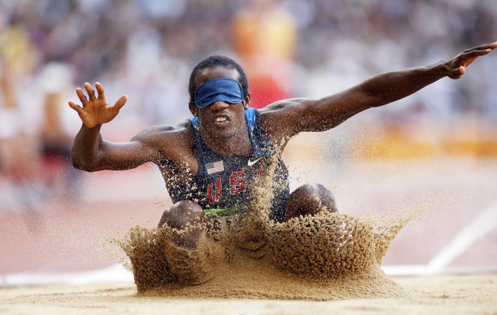 Lex Gillette of the US lands in the sand during the final of the men's long jump F11 classification event at the 2008 Beijing Paralympic Games in Beijing on September 15, 2008. 