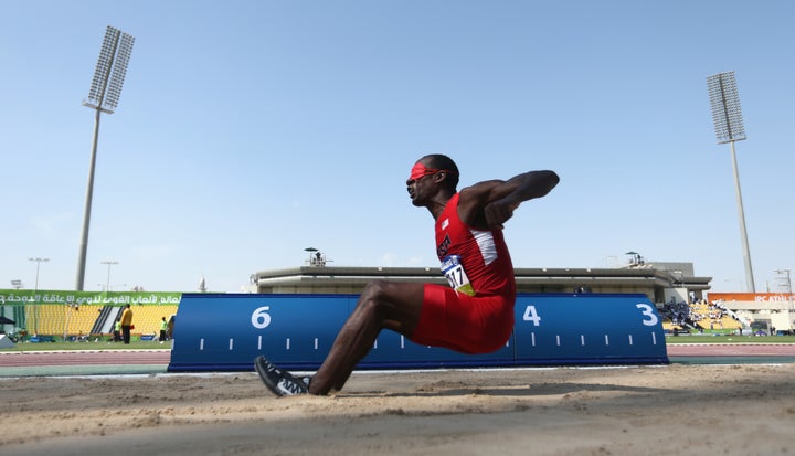 Lex Gillette of the United States competes in the men's long jump T11 final during the Morning Session on Day Six of the IPC Athletics World Championships at Suhaim Bin Hamad Stadium on October 27, 2015 in Doha, Qatar.